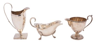 A George III silver cream jug, Benjamin Mountigue, London 1791, of classical helmet form,