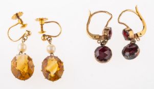A pair of citrine and seed pearl earrings, the oval cut citrine suspended below a seed pearl,