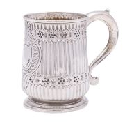 A George II silver mug, maker's mark rubbed, London 1744 with later embossed decoration,