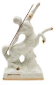 A bottle of Remy Martin Fine Champagne Cognac in a 'Centaure Limoges' ivory porcelain decanter,