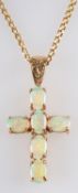 A 9ct gold, cabochon-cut opal crucifix pendant, together with a curb-link chain, stamped '9CT',