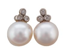 A pair of cultured pearl and diamond ear studs, diameter of cultured pearls ca. 8.