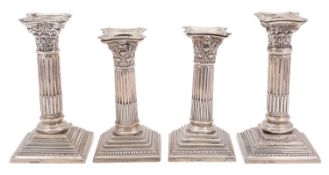 A pair of Edward VII silver Corinthian column candlesticks, maker George Nathan & Ridley Hayes,