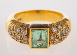 An 18ct gold, aquamarine and diamond ring,