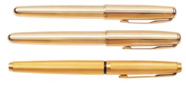 A Parker Sonnet fountain pen and roller ball pen set, with reeded gold plated cap and barrels,