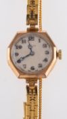 Rolex, a lady's 9ct gold wristwatch the round dial with raised Arabic numerals and signed Rolex,
