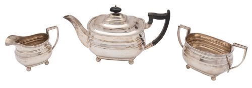 A George V silver three piece teaset, William Hutton & Sons Ltd, Birmingham 1931, of barge shape,