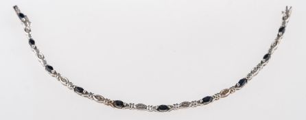 A 9ct gold, sapphire and diamond bracelet, set with marquise cut sapphire and eight cut diamonds,