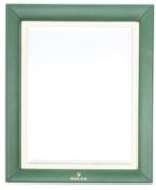 A Rolex green leather countertop advertising mirror,