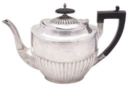 A Victorian silver teapot, Walker and Hall, Sheffield 1898, of oval form,