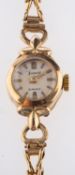 Accurist, a lady's gold wristwatch the round dial signed Accurist 21 Jewels,