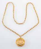 An octagonal locket pendant, with hinged cover, and a belcher-link chain, stamped '9CT',