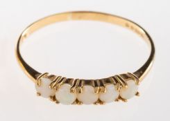 A 9ct gold opal ring, set with five circular cabochon opals,