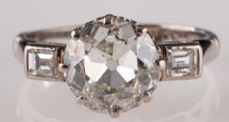 An old and baguette-cut diamond, three-stone ring, accompanied by WGI report nr.