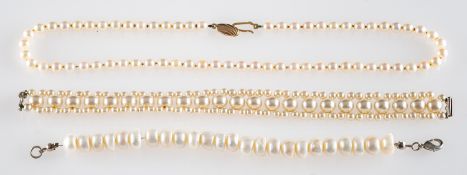 A cultured pearl necklace, composed of uniform cultured pearls, the clasp stamped 375,