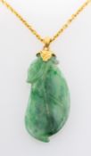 A jade pendant, carved in the shape of a gourd, the bale stamped '14K', length of pendant ca. 3.