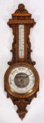A late Victorian oak 'banjo' wall barometer,