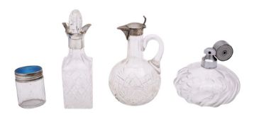 A group of silver and glass bottles, comprising a German silver claret jug, maker ELIMEYER,