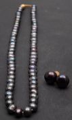 A single-row, cultured 'Tahitian' pearl necklace and pair of cultured, 'Tahitian', button,