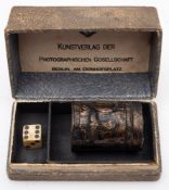 A 1936 Olympic German Art Publisher Photographic Society Commemorative dice shaker and die in