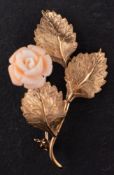 A 1970's, 9ct gold and carved coral spray brooch, total length ca. 4.8cm, total weight ca. 5.3gms.