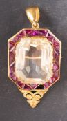 An octagonal, step-cut citrine and calibre-cut probably amethyst brooch/ pendant,