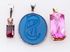 A Platinum Rubellite Pendant, claw set with a rectangular garnet and a rubellite tourmaline,