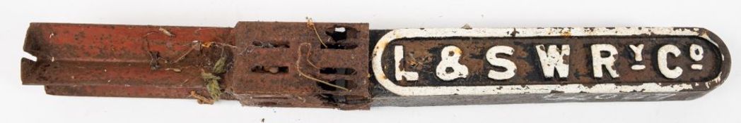 A L & SWR Ry, Co. cast iron boundary marker, highlighted in white to one side, 43cm long.