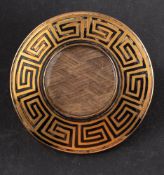 A Victorian mourning brooch, the central glazed compartment with hairwork,