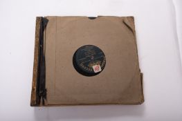 A small collection of gramophone discs.