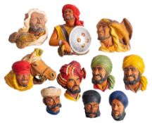 A group of nine painted plaster figural