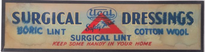 A Ucal 'Surgical Dressings' glass advertising sign 14 x 54cm