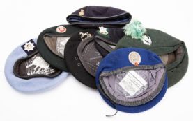A group of seven various berets,