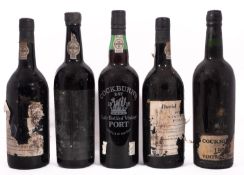 Four Vintage Port. two Gould Campbell 1977, one Cockburn 1963, one illegible 1970 & one Cockburn L.