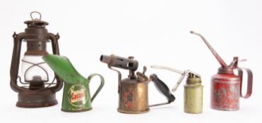 A small green Castrol oil jug, two oil cans, a small Tilly lamp, and a brass blow torch, (5).