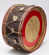 An early 20th Century military wood body bass drum complete with cord suspension ropes and tension