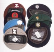 A group of seven various berets, including Royal Hussars,