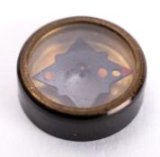 A WWII button compass.