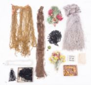 A collection of early 20th century silk fringing, beadwork and textile accessories, hooks and eyes,