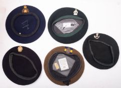 A group of five various berets, including Queens Royal Irish Guards,