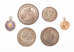 A group of four circular intaglio seals,