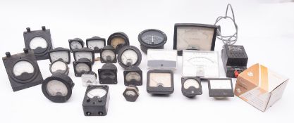 A collection of various volt and amp meters, including an Air Ministry Micrometer.