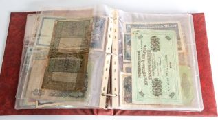A mixed album of world banknotes, including USA, Russia, Germany ,