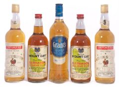 Four bottles old rum and one bottle Grants cask conditioned whisky.