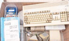 A Commodore Amiga A500 Personal Home computer, together with an Amiga A1200 home computer,