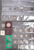 A group of coins including two 1887 double Florins with 1888 double Florin, two 1887 Florins,