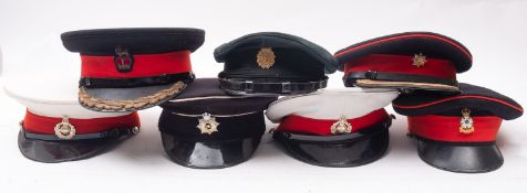 A group of seven various peaked caps, including two Royal Marines peaked caps,