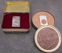 A Zippo 60th Anniversary 1932-1992 lighter, in original tin.