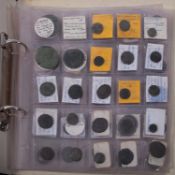 A collection of coins in an album,