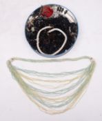 An early 20th century 'Flapper' style beadwork necklace in light green, cyan colours,